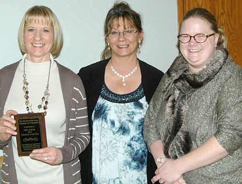 Julie Aldrich, left, was honored as the Stewartville Area Chamber of Commerce's Volunteer of the Year for 2013 at the Chamber's annual banquet on Saturday, Jan. 18. Deann Stowers, Chamber president for 2013, center, and Gwen Ravenhorst, Chamber administrator, presented the award.