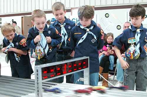 Cub Scouts in Pack 156's Bear Den watch their cars cross the finish line at the annual Pinewood Derby at Grace Evangelical Free Church on Saturday, Jan. 25. Scouts include, from left, Xavier Kassel, Ian Reese, Thomas Root, Brady Hoult and Zach Boelman.