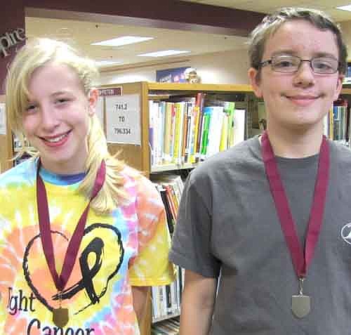 Ellie Fryer, left, placed first and Nathan Laures was second in the Stewartville School District's spelling bee on Wednesday, Jan. 22. The two seventh graders now advance to the Regional Spelling Bee at Southeast Service Cooperative (SSC), 210 Wood Lake Drive, Rochester, on Tuesday, Feb. 11. Ellie and Nathan were the only two spellers left when Ellie correctly spelled "boutique" to win the contest. Nathan missed on "autobahn." Nathan explained why he and Ellie are good spellers. "We both read a lot," he said.