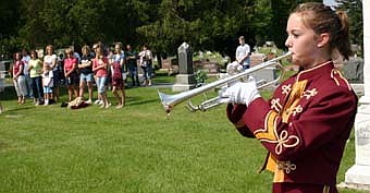 IN THEIR MEMORY -- Sara Zent of the Stewartville High School Band plays taps during the annual Memorial Day ceremony at Woodlawn Cemetery on Monday, May 28. 
