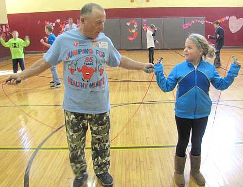 Mayor Jimmie-John King, left, prepares to jump rope with Ariaya Herman, a fifth grader, at Central Intermediate School on Monday, Feb. 3.