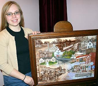 Jenni Cachiaras, employed by Peters Photography, who worked from photographs to complete an oil painting celebrating the sesquicentennial. Highlights of her work include drawings of the Opera House, Lake Florence, the Sears House and more. 