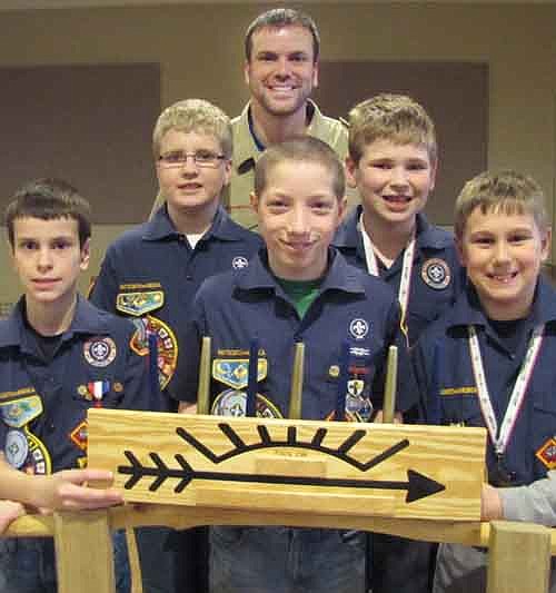 Cub Scouts from Pack 156 crossed over to Boy Scouts during a ceremony at the Stewartville American Legion Post 164 on Sunday, Feb. 16. The Webelos who took part in the bridging ceremony include, from left, Scott Boelman, Kertis Stensrud, Hunter Olson, Burkely Ravenhorst and Ethan Stone. All the boys earned the Arrow of Light Award, the highest honor in Cub Scouts. Hunter received the Super Achiever Award by earning all 20 available pins during his time as a Webelo. Corey Boelman, cubmaster of Pack 156, stands in back.