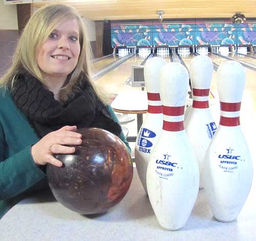 Andrea Garrison, competing for the State Farm Insurance "Good Neighbors" team, bowled a perfect 300 game at Strikers Corner in Stewartville last Tuesday evening, March 18.