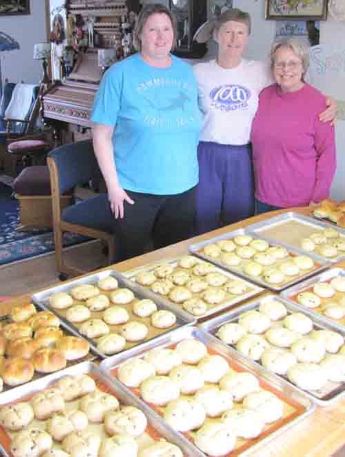 From left, Stephanie Peterson, Julie Hayes and Marilyn Wester worked together last week to bake 280 hot cross buns for the members of St. Bernard's Catholic Church, who took them home on Holy Thursday evening. Hayes hosted the baking at her Stewartville home. "This is my Lenten act of service," she said.
