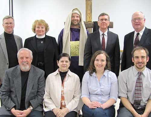 Pastors from a number of Stewartville churches took part in an ecumenical Good Friday service at the Stewartville  Civic Center on Friday, April 18. They include, front row, from left, Dave Hoot and Becky Hoot of Stewartville Christian Church, Anna Wencl of Zion Lutheran Church, and Chad Skaran of First Baptist Church. Back row, from left, Byron Meline of Zion Lutheran Church, Marie A.K. Anderson of Zion Lutheran Church, Josh Kruger of New Life Community Church, Dr. John Grams of Grace Evangelical Free Church and Wane Souhrada of Stewartville United Methodist Church. Each pastor played a role of an individual involved in Jesus's crucifixion. Kruger is dressed as Caiaphas the high priest.