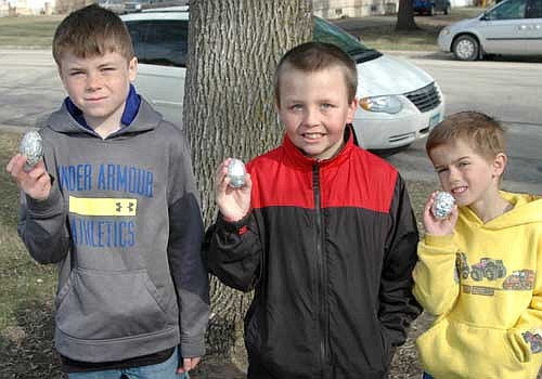 From left, Jackson Helget, 11; Jacob Higgins, 8; and Jesse Peterson, 5, all of Racine, won gift cards to Wal-Mart for finding the silver eggs at the Racine Lions Club's annual Easter Egg Hunt in Racine on Saturday, April 19. Jack-son's gift card was worth $100, Jacob's was good for $75 and Jesse's was worth $50.