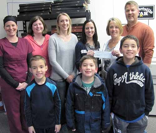 Students in the Stewartville School District recently sold magazines and Stewartville STAR subscriptions to raise money for BACPAC (Bonner and Central Parent Advisory Committee). The STAR has donated $675, or 10 percent of the proceeds from the sales of the newspaper, back to BACPAC. Front row, from left, are students Carter Miller, Logan McCrady and Brandon McCrady. In back, Judy Schroeder, co-publisher of the STAR, second from right, joined by husband Bill Schroeder, STAR co-publisher, presents the check to Jen Miller, president of BACPAC. In back, from left, are Heather Horstmann, vice president of BACPAC; Carrie Anderson, treasurer; and Shelly McCrady, secretary.