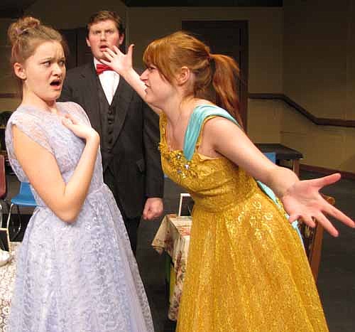 Athena Sinclair (Kaitlyn Claeys), left, and Claudia McFadden (Cassidy McCartan) confront each other about who gets to stay in the presidential suite as Mr. Dunlap looks on in horror.