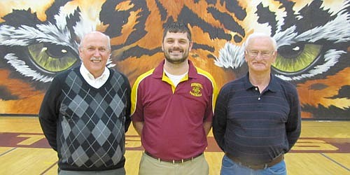 With plenty of help from his friends, Jon Severson, head boys varsity basketball coach at Stewartville High School, center, has established the Stewartville Athletic Hall of Fame. Two members of the Hall of Fame Committee include Bill Glomski, left, and Darrel Jaeger.