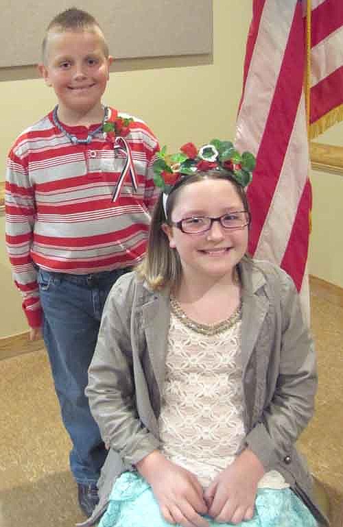 Nevaeh Crowson, a third grader at Central Intermediate School, seated, was the poppy princess and Evan Riggin, a third grader at Bonner Elementary School, was the poppy prince during Stewartville's annual Memorial Day ceremonies on Monday, May 26. The two rode in the Memorial Day parade.