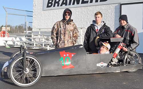  Jacob Vetsch, in the driver's seat, and standing from left, Evan Doty, Jacob Goeldi and Clayton Vrieze built the Mystery Machine. LeRoy Malone is missing from the photo.