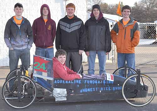 Kurtis Keller, in the driver's seat, and, standing from left, Colton Mason, Jacob West, Darin Horstmann, Jared Trisko and Sam VandeLoo built Dynamo, which averaged 220 mpg.