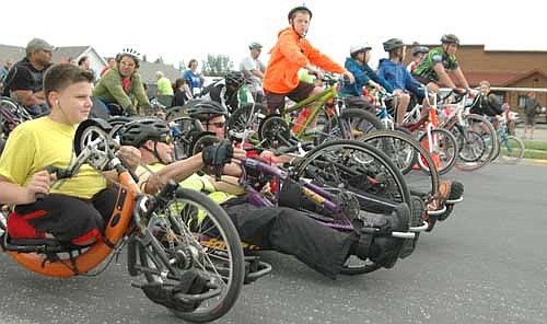 Participants in Ironwood Springs Christian Ranch's annual National Wheelchair Sports Camp line up for the Heels & Wheels of Fire 10K race from Pizza Ranch to Ironwood Springs on Saturday morning, June 14.