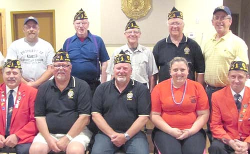 Myron Ehrich, first district commander, and Glenn Mueller, first district membership chair, installed the Stewartville American Legion Post 164's local officers for 2014-15 on Monday evening, June 16. Front row, from left, are Ehrich, along with local Legion officers Richard Paulson, first vice commander; Thom Blade, commander; Kristin Anderson, second vice commander; and Mueller. Back row, from left, Chet Finley, finance officer; Jerry Korstad, chaplain; Roger Barsness, adjutant; Wes Alrick, judge advocate; and Dean Ramaker, historian.