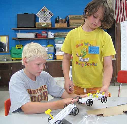 Carrick Olswold, 9, of Stewartville, left, and Lucca Sween, 9, of Spring Valley work together to build cars of their own at Camp Invention at Bonner Elementary School last week. Thirty-two students going into grades one through six took part in the annual camp, designed to supplement the lessons students learn during the school year in science, technology, engineering and math, otherwise known by the acronym STEM. Dave Sklenicka, a science teacher at Stewartville High School and director of Camp Invention, said that the camp encourages inventiveness.