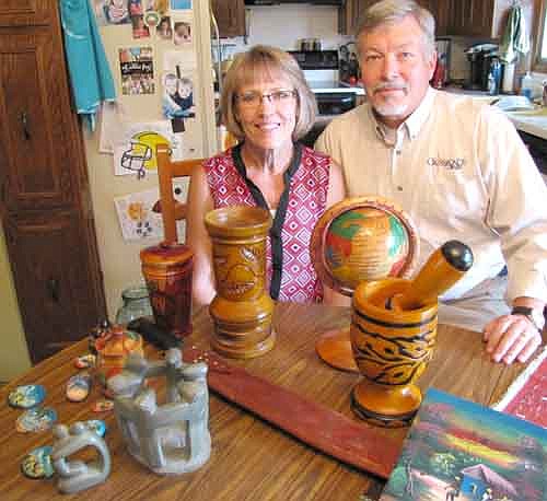 Roger and Lynn Langseth display a number of items they have brought back from Haiti.