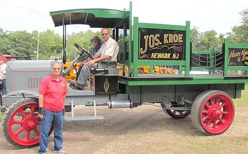 Sue Dougan, former president of the Root River Antique Historical Power Association, stands near the circa 1918 Twin City truck she brought to the 32nd annual Root River show south of Racine July 18-20. Jon Ludemann of Ostrander is the driver. 