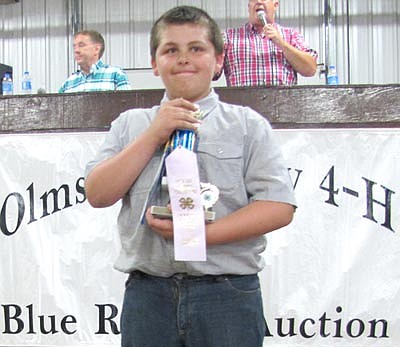 Alex Parker of the Rock Dell Indians 4-H Club was the reserve champion for his pen of three rabbits. Oak Knob farms bid $150 for the rabbits at the Fair's Blue Ribbon Auction.