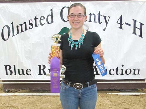 Amelia Welter, right, a member of the High Forest Chippewa Champions 4-H Club, was the champion senior showperson for swine. She was also named champion for her painting of an eagle. 