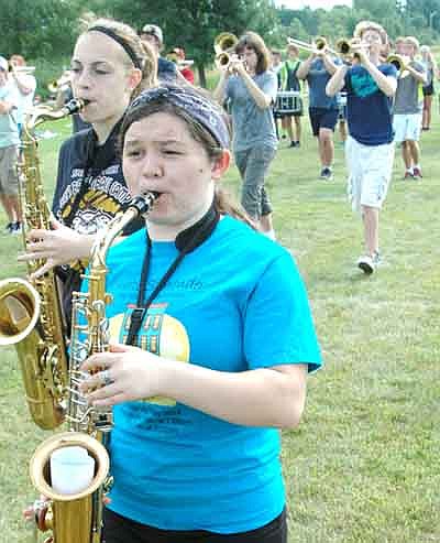Jessica Honsey, director of the Stewartville High School Marching Band, instructed her students during last week's SHS Band Camp to help the musicians prepare for performances at the State Fair on Aug. 24, at Waseca on Sept. 20, at Luverne on Sept. 27 and at Algona, Iowa on Oct. 4. Here, Christine Deetz, foreground, and Heather Husgen march together.
