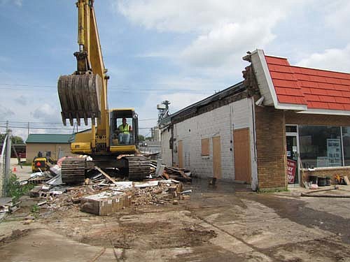 Crews tore down the old Greenway service garage along Main Street in Stewartville last week. Tim Clemens, general manager of Greenway, which has merged with Cenex Harvest States (CHS), said that the building was in poor shape. "It was beyond repair," he said. "We didn't feel the roof was safe." The company has no current plans to build anything else at the site, Clemens said.