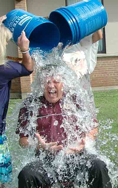 Local school administrators answered the ALS Ice Bucket Challenge near Stewartville High School last Tuesday morning, Aug. 26. Here, Dr. David Thompson, superintendent, wails in pain as the icy water hits his body while answering the Ice Bucket Challenge.