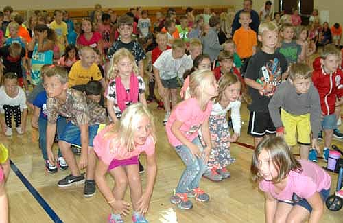 As of late August, about 2,000 students were enrolled in Stewartville schools. All but the kindergartners returned to school for the start of the 2014-15 school year last Tuesday morning, Sept. 2. Above, the first, second and third-graders at Bonner Elementary School enjoy a 15-minute music and movement session at the school's gym. Kathy Williamson, a physical education teacher, and Lara Smoley, a music teacher, led the session.