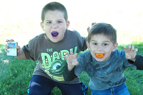 Children and adults alike had plenty of fun at the 91st annual High Forest Old Settlers Day on a sunny and beautiful Saturday afternoon, Sept. 13. Here, Jake Keefer, 6, of Stewartville, left, and Jackson Lopez, 4, of Rochester, are frightening with their purple and orange teeth. 