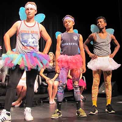 From left, freshmen James Krukow, Tyler Laures and Philip Gonzales display their winged outfits at the coronation ceremony at the SHS Performing Arts Center on Monday, Sept. 29.