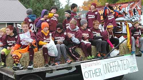 Stewie's sixth-grade RYFA football team, sponsored by Sammy's, rides on a float during the SHS Homecoming parade.  The team earned a 16-0 record through its fourth and fifth-grade seasons and is 5-0 this season.