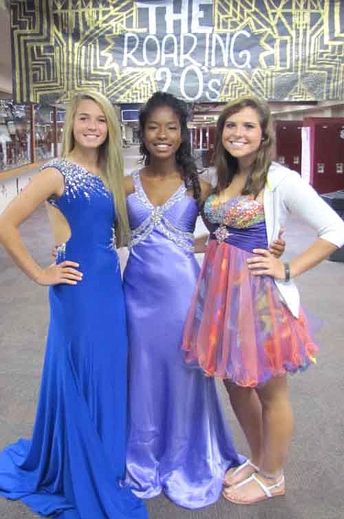 TOO CLASSY -- From left, Stewartville High School seniors Brianna Henderson, Anahi Smith and Carly Wilde wore dresses from the 1920s for Too Classy Tuesday.