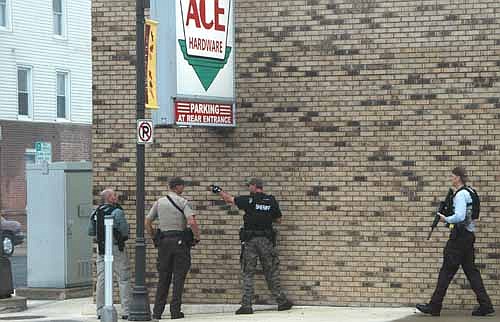 Officers from the Olmsted County Sheriff's Office, Rochester Police Department and the Minnesota State Patrol surrounded the old Tews Hotel in downtown Stewartville on Thursday morning, Oct. 2.  After responding to a domestic disturbance, authorities learned that a 29-year-old man possibly armed with a gun was inside one of the old hotel's apartments.