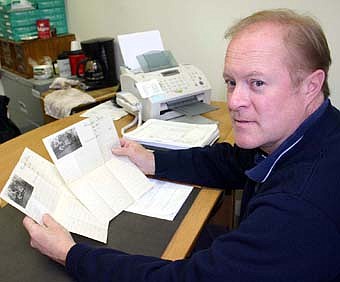 Joel Packer, Stewartville's postmaster, displays the front sides of the four-page letter that Charles Wauzee Cussons wrote to Robert Wertz in Wernersville, Penn. on June 20, 1916.  Packer, a Stewartville memorabilia enthusiast who now lives in Cussons' house, purchased the letter on ebay for $20.  The letter came back to its original home on Saturday, Jan. 5.  