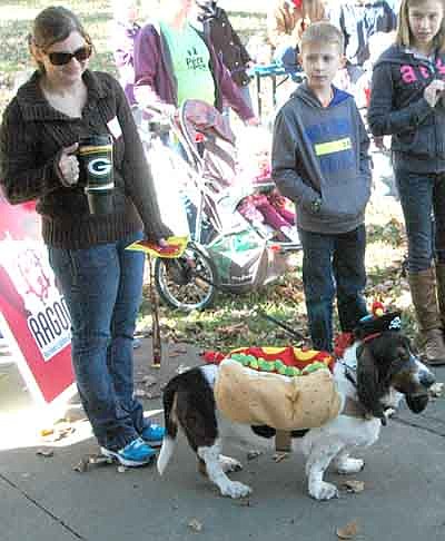 Dogs of all sizes enjoyed their time in the spotlight at the Stewartville Area Chamber of Commerce's first-ever Pets in the Park event at Florence Park on a beautiful autumn day on Saturday, Oct. 11. Here, Olivia Renken of Stewartville, left, stands with Otto, her basset hound. Otto, dressed as a hot dog pirate, placed second in the costume contest.