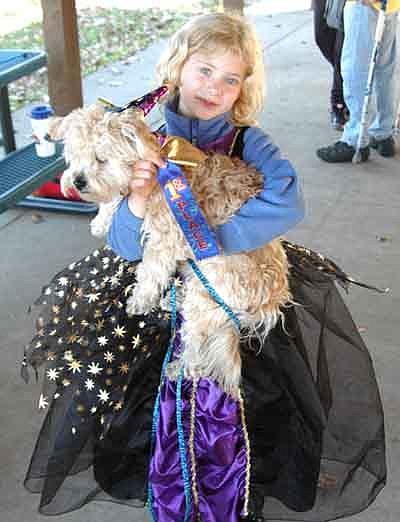 Dogs of all sizes enjoyed their time in the spotlight at the Stewartville Area Chamber of Commerce's first-ever Pets in the Park event at Florence Park on a beautiful autumn day on Saturday, Oct. 11. Here, Greta Ravenhorst and Buddy, her 7-month-old "morkie," won first place in the Pets in the Park costume contest.
