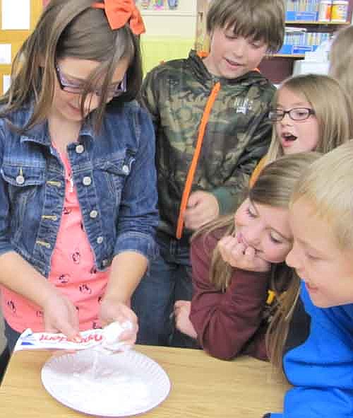 Central Intermediate School held an anti-bullying lesson on Oct. 22. Here, fourth grader Olivia Frenning struggles to get the toothpaste back into the tube as classmates, from left, Brady Hoult, Gabi Hameister, Alayna Sickle and Adam Kemp look on.