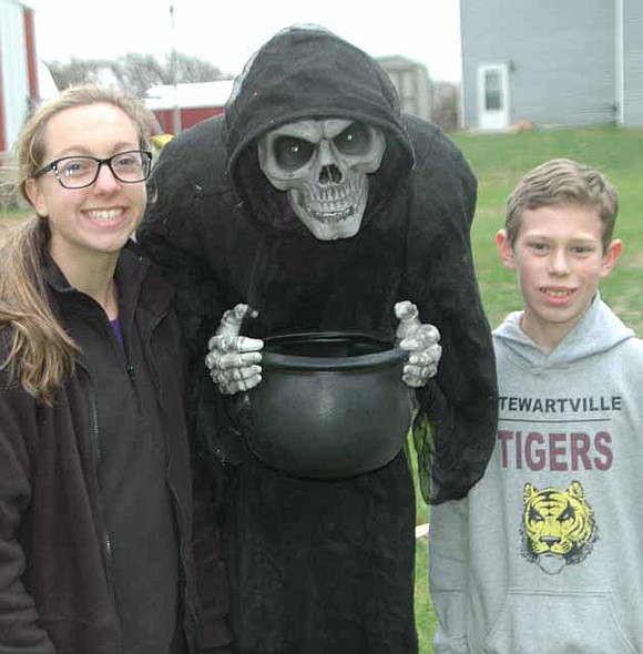Jade Schmeling, left, a sophomore at Edina High School, and her cousin Gabe Nelson, an eighth grader at Stewartville Middle School, invited their friends to the third annual Spook City in the Woods near Racine on Friday and Saturday evenings, Oct. 17 and 18.  A total of about 380 guests walked a sectioned-off path decorated with zombies, witches, skeletons, spiders and more. Proceeds from the event went to PACER, an anti-bullying organization.
