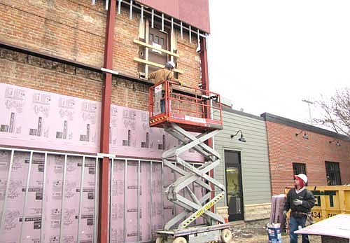 Nels and Nicole Pierson, who bought the Stewartville STAR building for $1 in March 2012, have begun the third phase of remodeling the structure. Workers placed insulation on the west side of the south wall of the building last week.