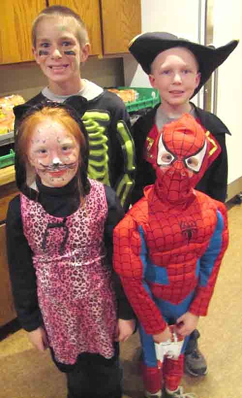 Many children enjoyed the Halloween party at the Stewartville American Legion Post 164 on Friday afternoon, Oct. 31. Here, the Anderson children of Stewartville include, front row, from left, Rachel, 8, who dressed as a pink cheetah, and Aaron, 7, who was Spider-Man. Standing in back are Mateo, 11, a skeleton/football player; and Aiden, 9, a pirate.