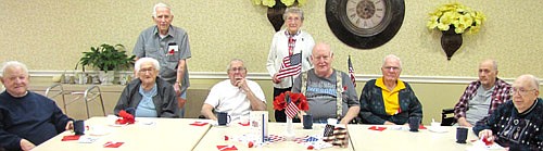 The Stewartville Care Center celebrated Veterans Day with cookies and ice cream on Tuesday, Nov. 11. Care Center residents who served in the military were the special guests for the day. They included, from left, Fahy Lowrie, Roger Carlson, Gordon Rentz, Gene Swygman, Florence Reinhart,  Burt Stiles, Roger Temanson, Leonard Stapleton and Clarence O'Neil. 