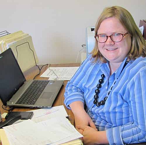 Gwen Ravenhorst, administrator for the Stewartville Area Chamber of Commerce, is happy to be in the Chamber's new office in the Dahl Copiers building along Stewartville's Main Street.