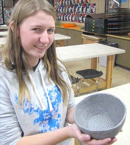 Makayla Morgan, 16, a junior at Stewartville High School, displays her bowl that will be sold at auction at the SHS Art Gala and Silent Auction on Dec. 5-7.