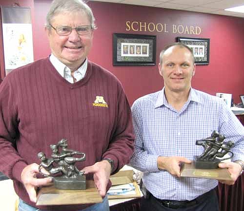 Rod Morlock, left, and Mark Vaupel, outgoing members of the Stewartville School Board, were honored with "Let's All Pull Together" awards at the School Board's last meeting of the year on Monday, Dec. 15. Vaupel decided not to seek re-election this past fall after serving on the School Board for 13 years. Morlock, who served one four-year term, said he enjoyed working with his fellow School Board members and the district's administration.