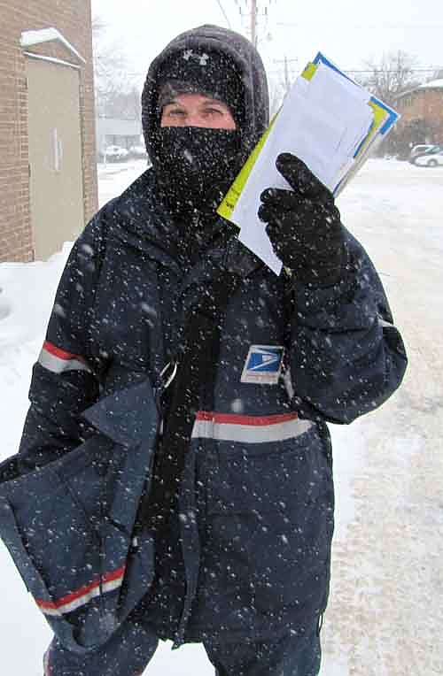 Jill Guy, a mail carrier for the U.S. Postal Service, battled sub-zero temperatures, gale-force winds and blowing snow as she made her rounds in Stewartville last week. "I wear three pairs of pants and two face masks," she said.