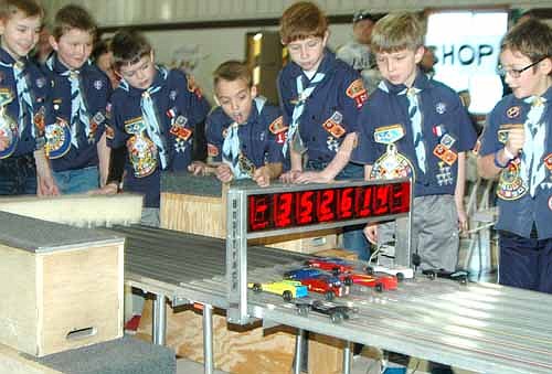 Cub Scouts watch their cars cross the finish line at the annual Pinewood Derby at Grace Evangelical Free Church on Saturday, Jan. 24.  Scouts include, from left, Zack Spitzer, Anthony Nelson, Charlie Wood, Leland Jeardeau, Braden Davidson, Garrett Norton and Tristan Knight.