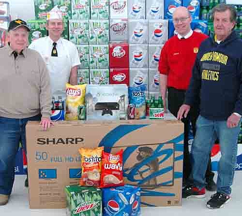 Denny Berhow (far left) of Stewartville and Roger Corcoran (far right) of Stewartville are the top prize winners of FAREWAY's 6th Annual "From Our FAREWAY Family to Yours." Berhow won the first prize, a 50-inch flat screen HDTV while Corcoran won the second prize, a XBox One Gaming System. Presenting and congratulating the two winners are FAREWAY Meat Manager Brett Struhar (second from left) and FAREWAY Store Manager Robert Hruska (second from right). FAREWAY's anniversary promotion is sponsored by FAREWAY, Frito Lays and Pepsi.