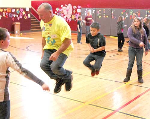 Mayor Jimmie-John King, second from left, jumps rope with fifth grader Jon Laures as fifth graders Elijah Wyant, far left, and Megan Parks twirl the rope at "Jump Rope for Heart" at Central Intermediate School on Feb. 2.