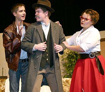 Noah Nelsen-Gross (Joe Lanconi), left, and Audra Mulleneaux (Mary Morlock) try to comfort Bekken Jagusch (Luigi Lanconi)  during a dress rehearsal of the Stewartville High School production of "Rest Assured," which will be presented at the SHS PAC this Friday and Saturday. 