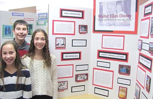 From left, triplets Emilee Otto, Nicholas Otto and Olivia Otto worked together to research the life of Walt Disney. "I wanted to do it because I really like Mickey Mouse," Nicholas said.